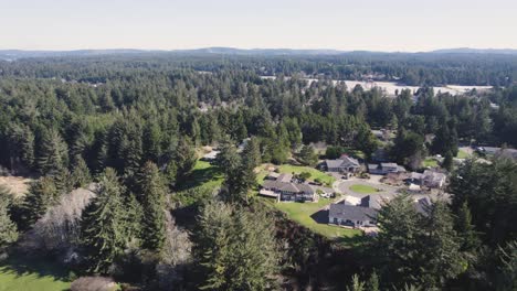 beautiful 4k aerial shot showcasing residential home in bandon, oregon during golden hour sunset