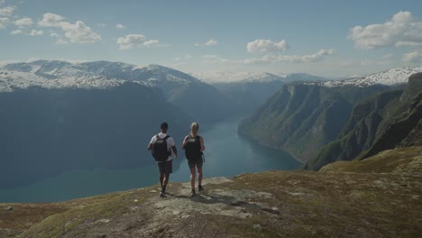 Hikers-admire-stunning-fjord-views-from-Mount-Prest-in-Norway