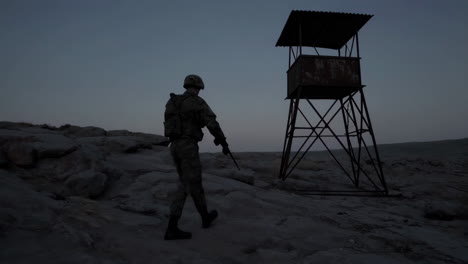 soldier on guard at a desert watchtower