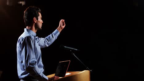 Male-business-executive-giving-a-speech