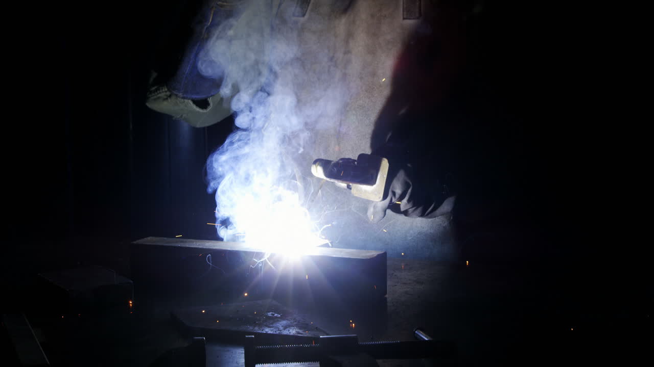 Welder welding a metal