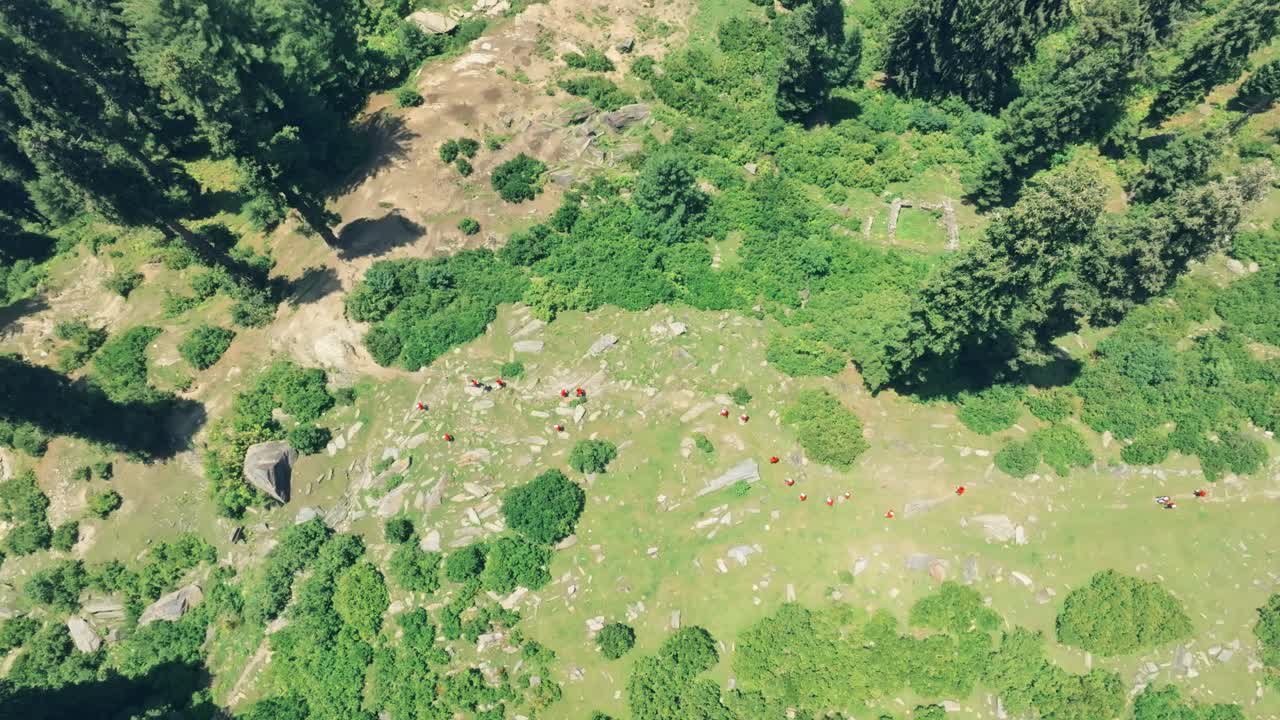 Drone view of people in red shirts exploring Malam Jabba SWAT during noon in Pakistan