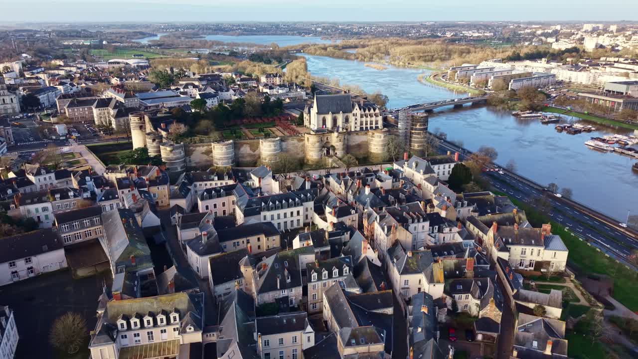 Château d'Angers fortress, the old town, and the Maine river in Angers, Loire Valley, France. Aerial drone panoramic view