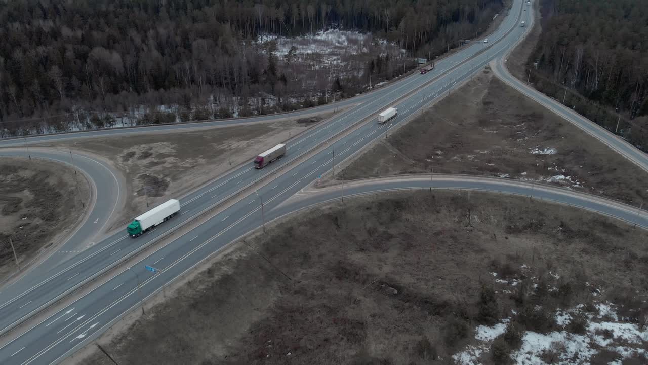 A car interchange with an overpass on a cloudy spring evening in the woods