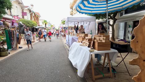 vibrant street market with food and clothing stalls