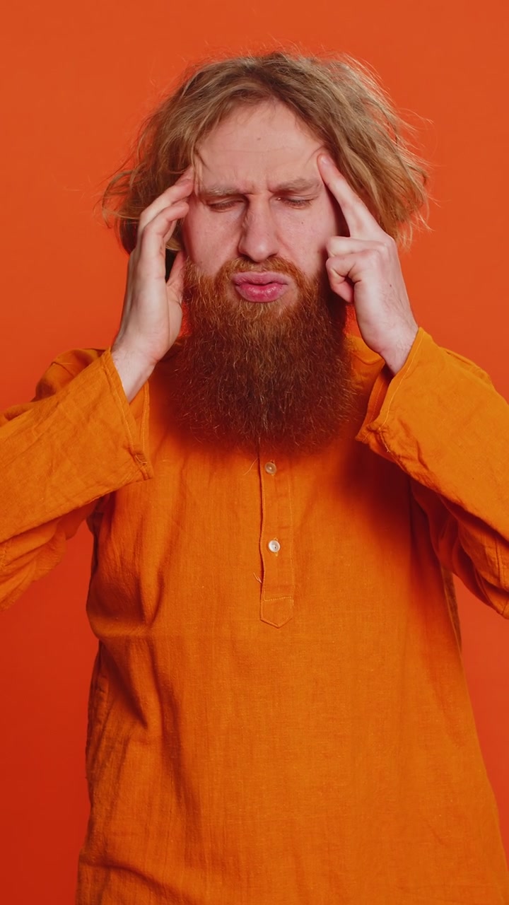 Caucasian man rubbing temples to cure headache problem suffering from tension migraine stress pain