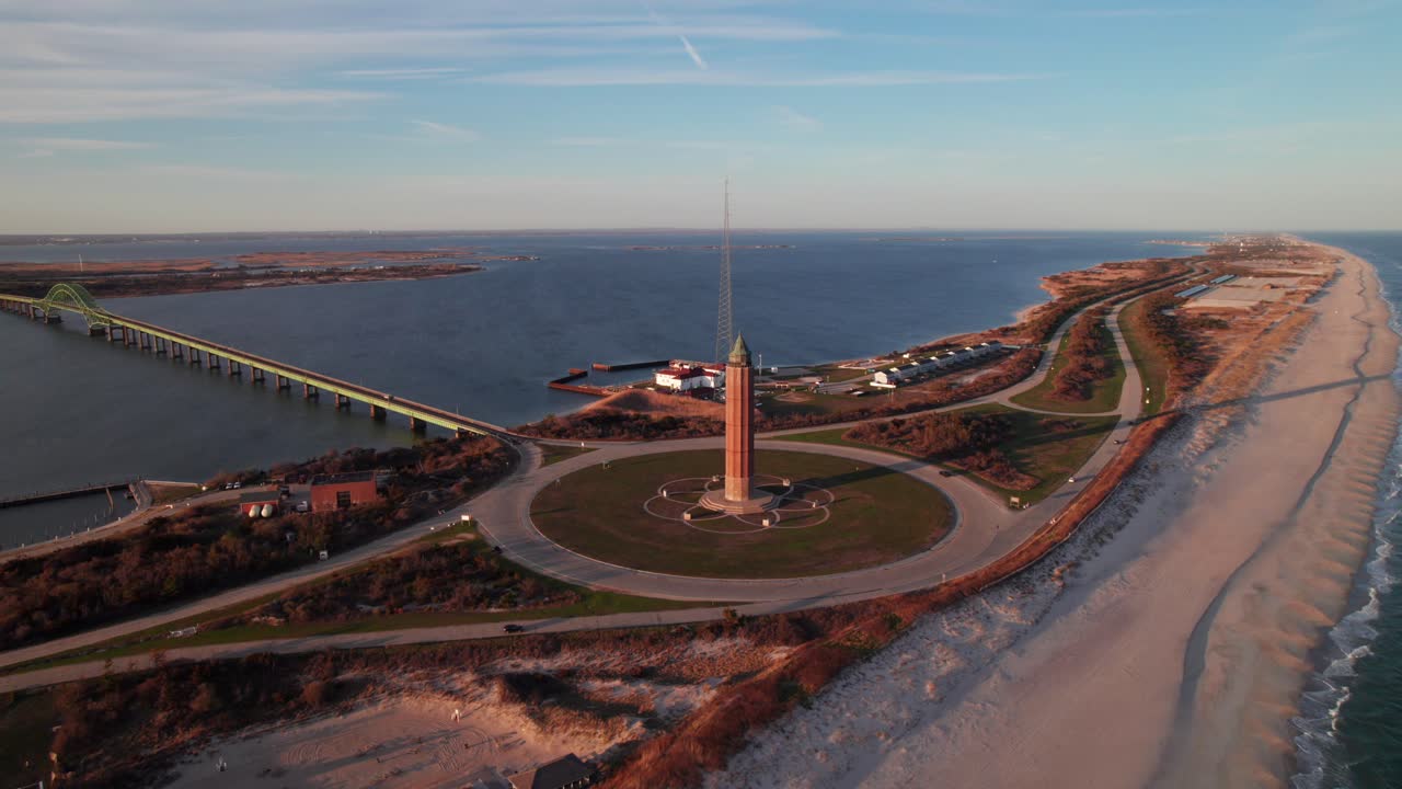 Gorgeous Fire Island and Robert Moses State Park, Long Island, NY. 4K aerial view of causeway, beaches, water tower at sunset.