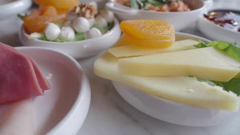 turkish breakfast with cheese, dried apricots, and mozzarella