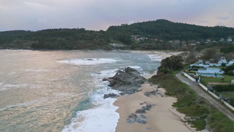 Aerial-view,-luxurious-houses-in-front-of-the-beach-in-Galicia,-Spain