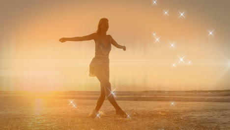 animation of floating stars over caucasian woman walking at seaside