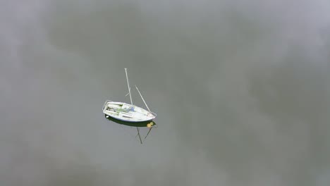 beautiful overhead aerial view, footage of sailing boats on rudyard lake in the derbyshire peak district nation park, popular holiday, tourist attraction water sports on offer, peaceful, calm water