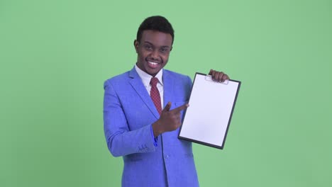 young african businessman with afro hair in suit