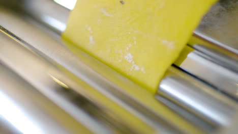 cook prepares pasta in kitchen