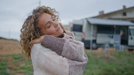 peaceful lady enjoy cloudy nature standing near modern campervan alone closeup.