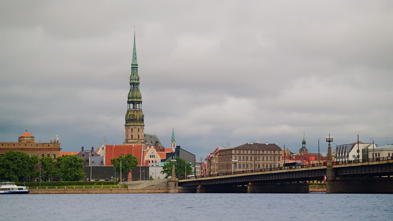 Timelapse captures moody cloud movement over Riga’s old town and calm river