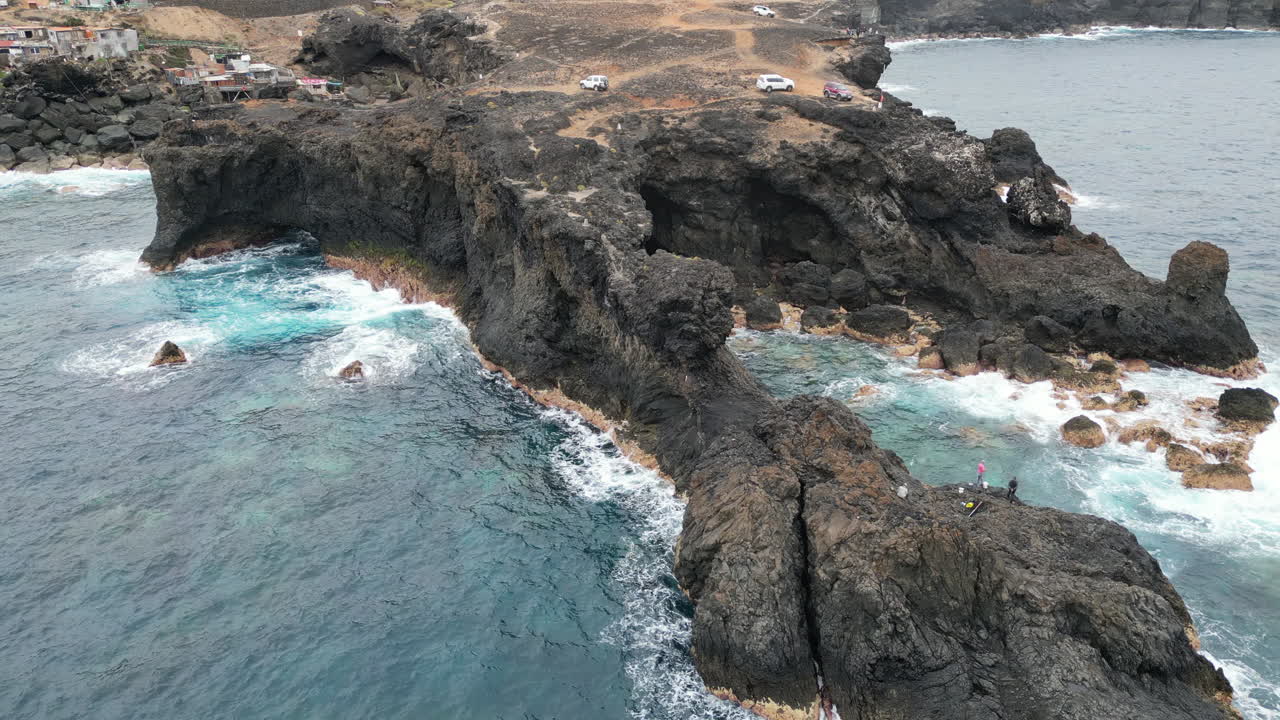 Volcanic cliffs and ocean waves crashing on Gran Canaria coast