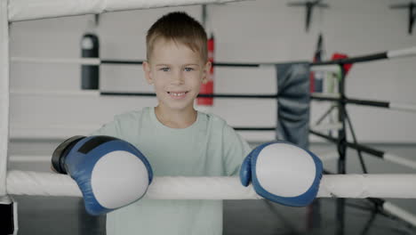 young boy in boxing gloves