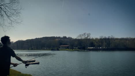 man casting his line with bait into the water