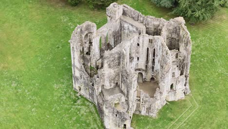 high-angle aerial view of interior of ancient wardour castle, medieval ruin surrounded by tranquility of english countryside