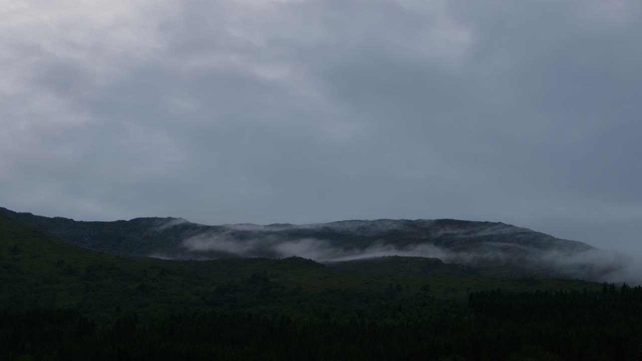 Cloud moves slowly over the mountain in Norway