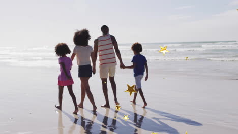 walking on beach, family enjoying time together with golden star animation overlay