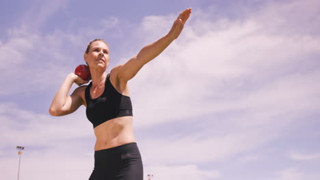 Sportswoman-practicing-shotput