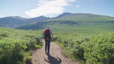 hiker walking towards mount bierstadt, colorado