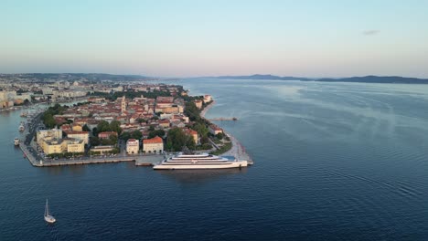 Sunset-Zadar-from-above-panorama-over-old-town-with-yachts,-marina,-cruiser