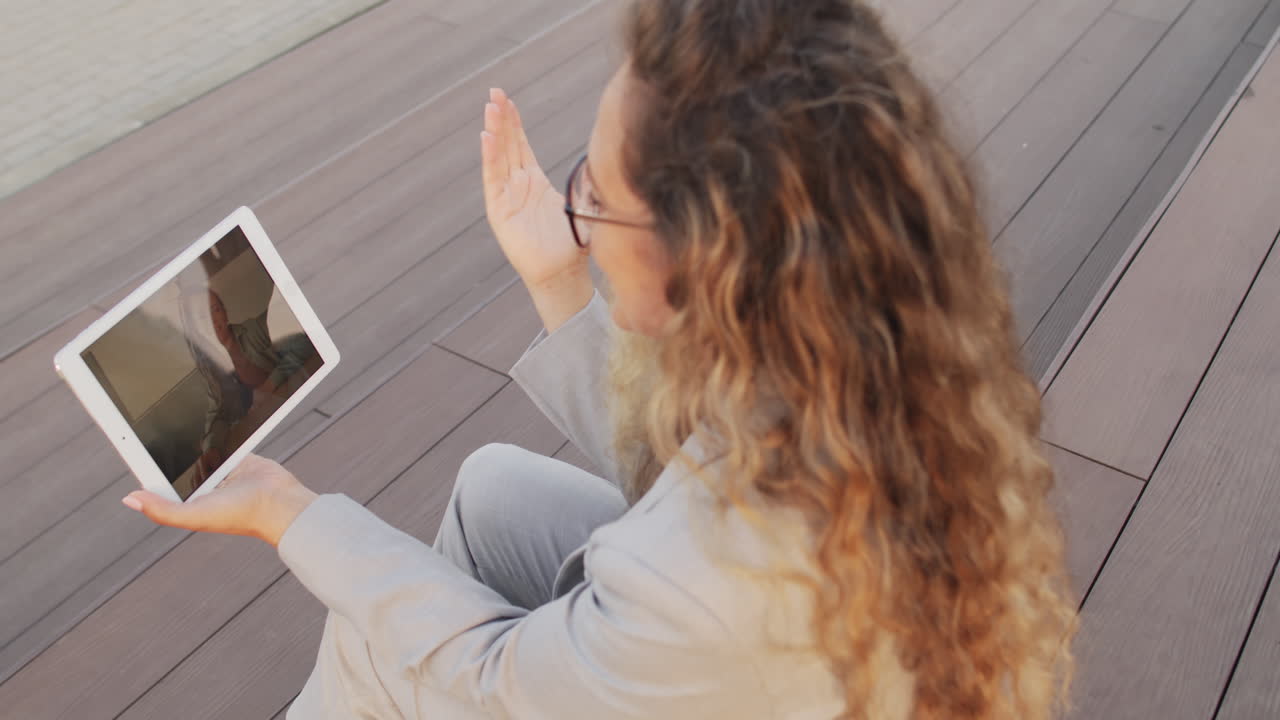 Business Woman Video Chatting on Tablet Outdoors