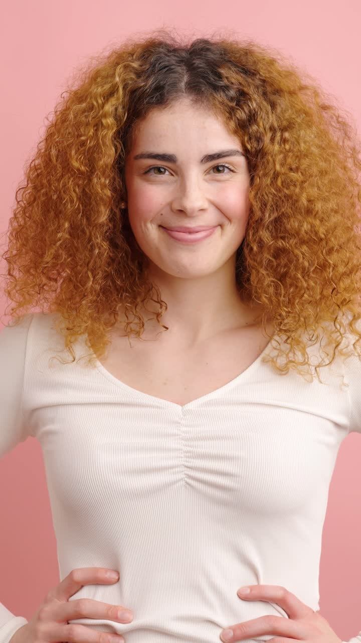Young redhead woman showing different happy facial expressions