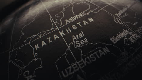 close-up of a globe highlighting kazakhstan and surrounding regions