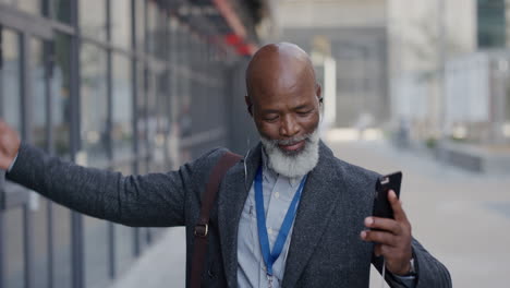 portrait happy mature african american businessman dancing in city listening to music wearing earphones enjoying successful urban lifestyle celebrating success slow motion