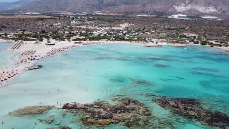 aerial flight revealing elafonissi's paradisiacal beach of white sand and turquoise water