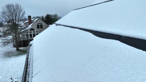 solar panels on american home covered in snow