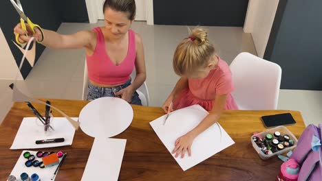 mother and daughter doing arts and crafts