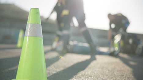 emergency cone, road and paramedic at an accident