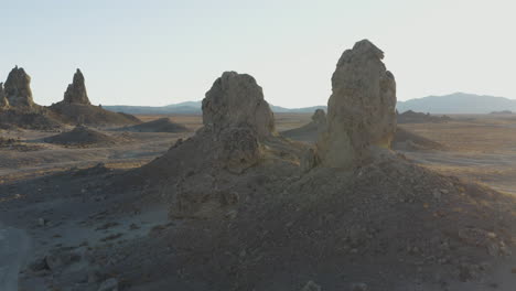 establishing aerial shot of wide pinnacles on a sunny day in the california desert