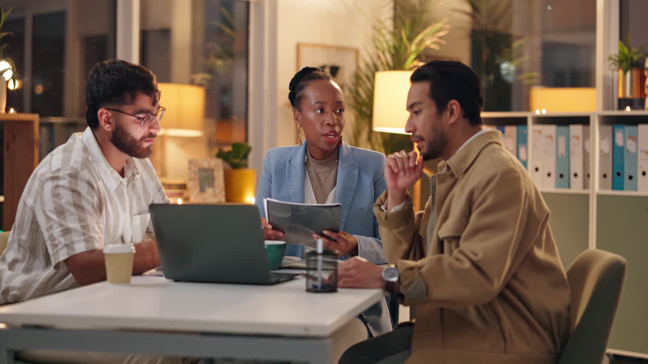 Business Meeting in Office at Night