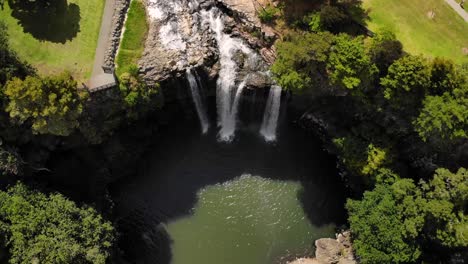 Whangarei-Falls-aerial-tilt-up-reveal-shot-of-picturesque-waterfall