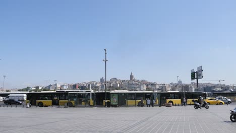 yellow buses at a bus stop in istanbul