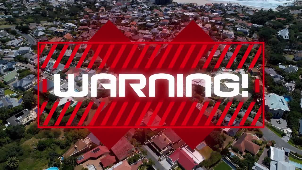 texto de advertencia y signo de cruz contra el paisaje urbano