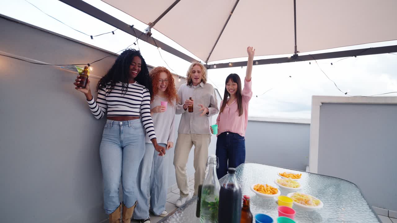 Group of friends celebrating at a rooftop party