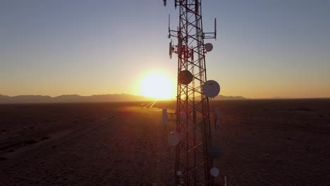 sunset over desert cell tower