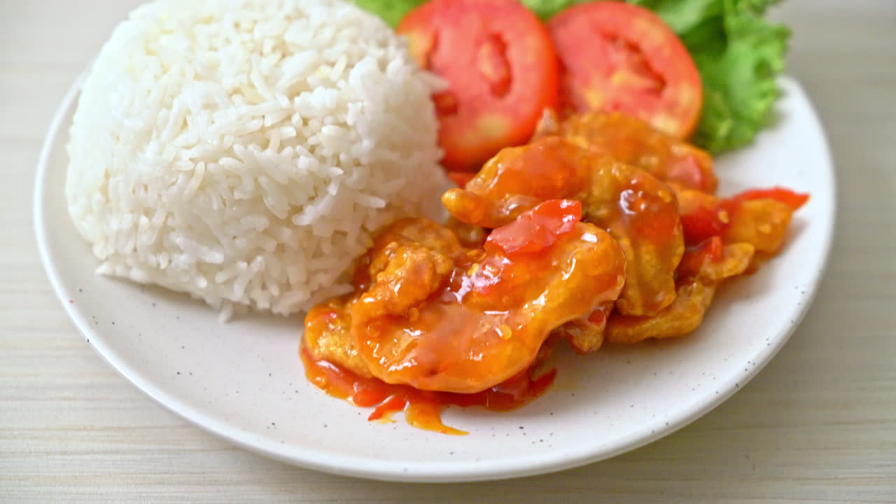 Fried fish topped by three flavors chili sauce with rice