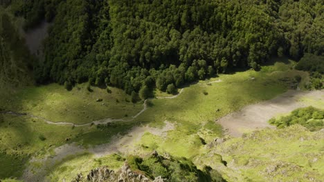 Aerial-dive-in-a-mountainous-valley,-in-the-Pyrenees,-in-Ariège---France