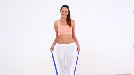 fit model standing and stretching resistance band