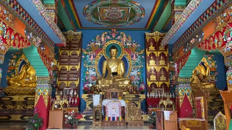 tourists worship the buddha statue inside of the buddhasikkhalay monastery at bodhgaya in bihar northeast india