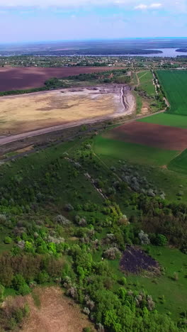beautiful diverse natural landscape outside of a big city. clouds throwing shadows on the ground. view from top. vertical video