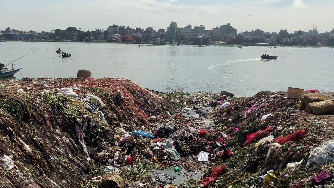 Polluted river bank of buriganga during day