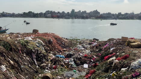 polluted river bank of buriganga during day